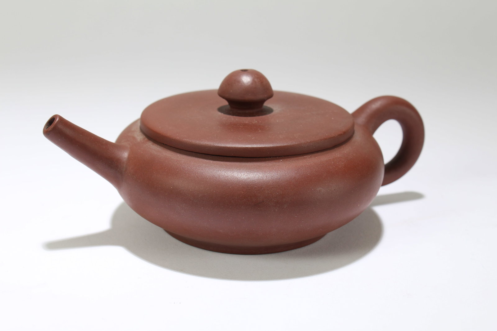 A Chinese Circular Fortune Tea Pot: A Chinese Circular Fortune Tea Pot . Height: 2.75 (inch). Length: 7 (inch).