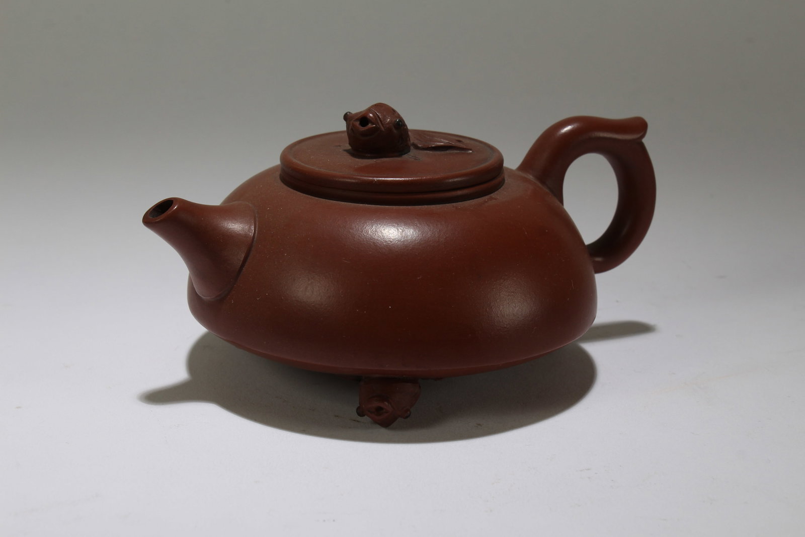 A Chinese Circular Lidded Tea Pot: A Chinese Circular Lidded Tea Pot. Height: 3 (inch). Length: 6 (inch).