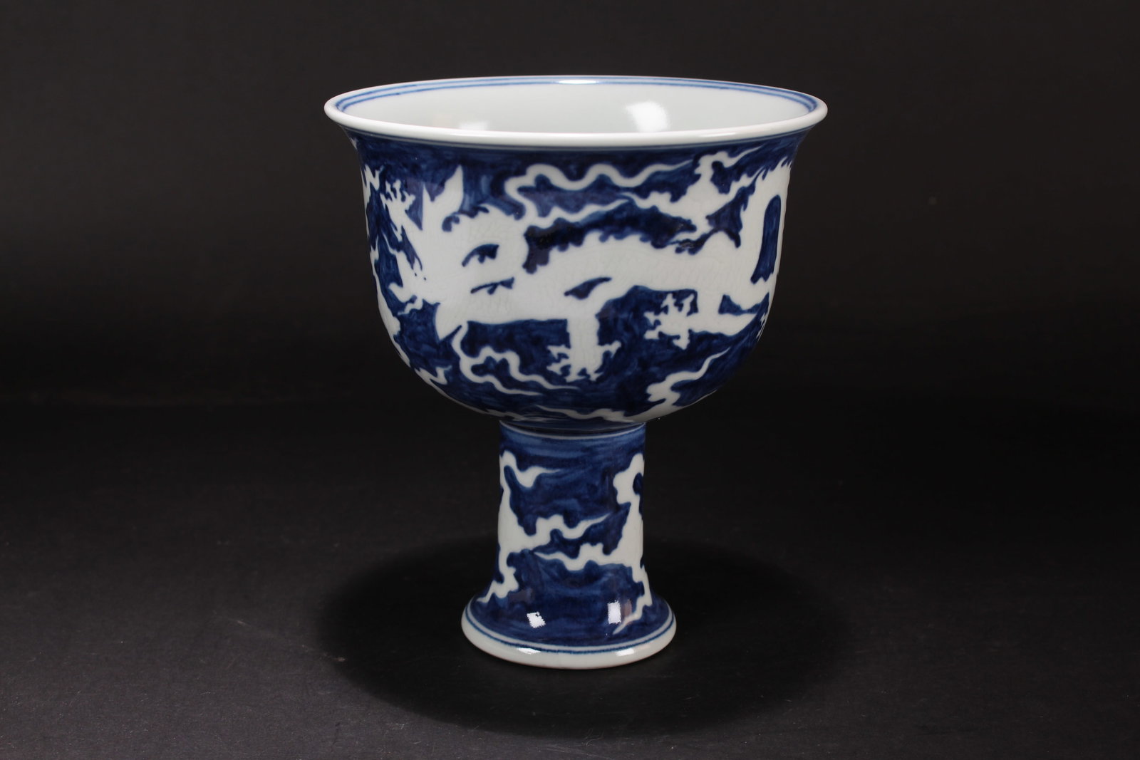 A Chinese Blue and White Dragon-decorating Porcelain Fortune Cup: A Chinese Blue and White Dragon-decorating Porcelain Fortune Cup. Height: 7 (inch). Opening Diameter: 6 (inch).