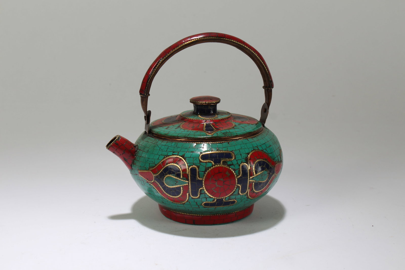 A Tibetan Religious Lidded Circular Tea Pot: A Tibetan Religious Lidded Circular Tea Pot. Height: 5.5 (inch). Length: 5.75 (inch).