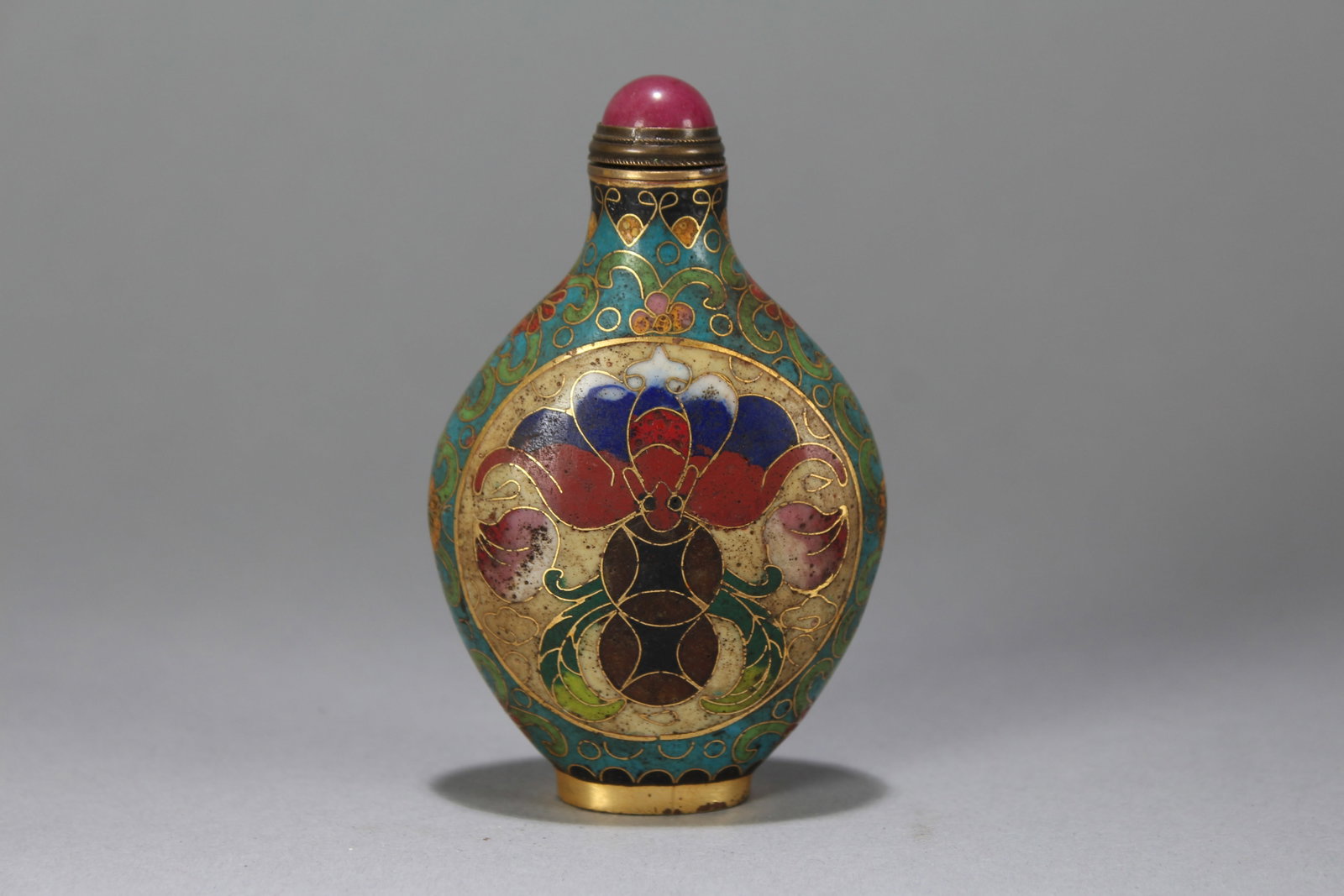 A Chinese Bat-framing Cloisonne Fortune Snuff Bottle: A Chinese Bat-framing Cloisonne Fortune Snuff Bottle. Height : 3.5 (inch). Width : 2.25 (inch). Length : 1 (inch).