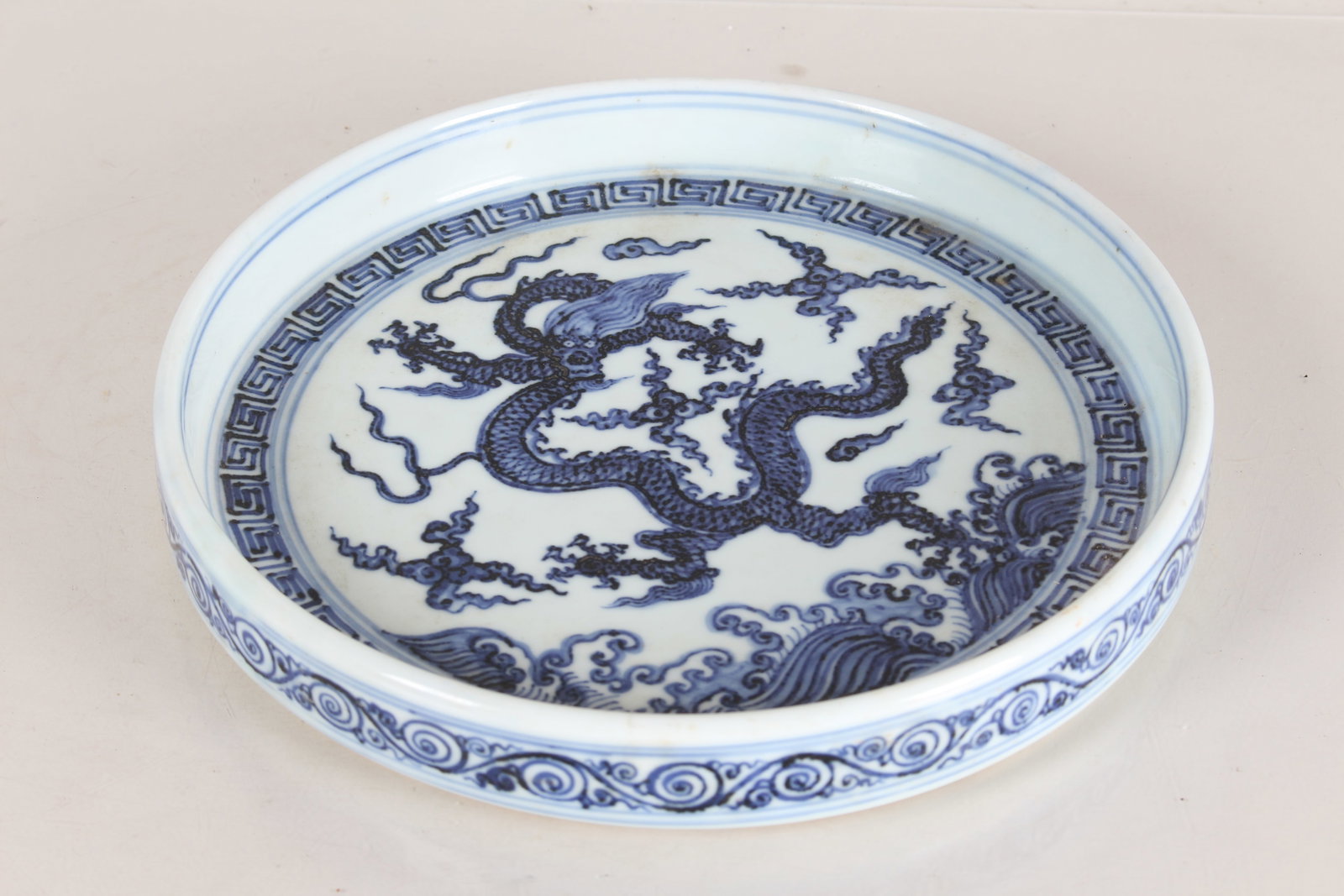 A Chinese Dragon-decorating Circular Blue and White Porcelain Fortune Plate: A Chinese Dragon-decorating Circular Blue and White Porcelain Fortune Plate. Height: 1.25 (inch). Opening Diameter: 9.5 (inch).