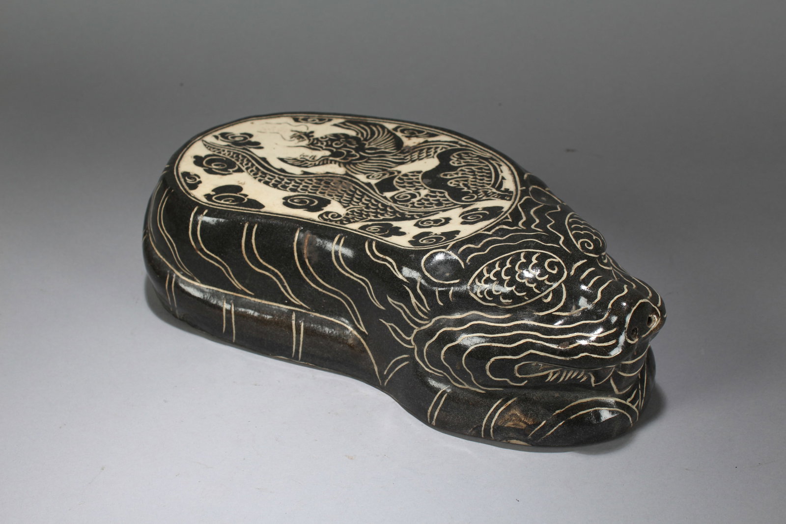 A Chinese Myth-beast Religious Porcelain Fortune Statue: A Chinese Myth-beast Religious Porcelain Fortune Statue. Height: 3 (inch). Width: 12 (inch). Length: 6 (inch).