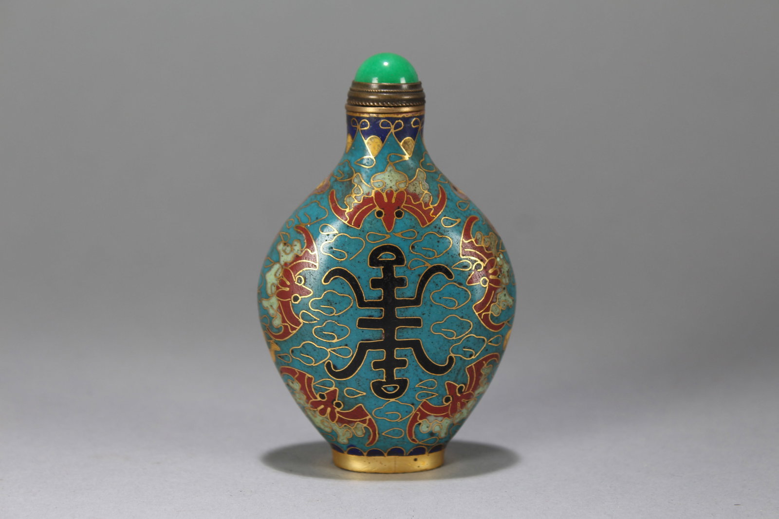 A Chinese Bat-framing Religious Fortune Cloisonne Snuff Bottle: A Chinese Bat-framing Religious Fortune Cloisonne Snuff Bottle. Height : 3.5 (inch). Width : 2.25 (inch). Length : 1 (inch).