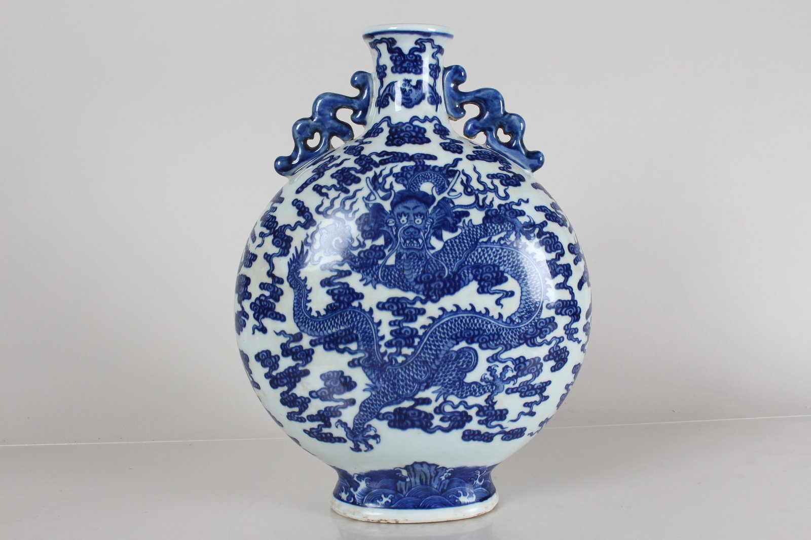 A Chinese Duo-handled Dragon-decorating Blue and White Porcelain Fortune Vase: A Chinese Duo-handled Dragon-decorating Blue and White Porcelain Fortune Vase . Height: 14 (inch).