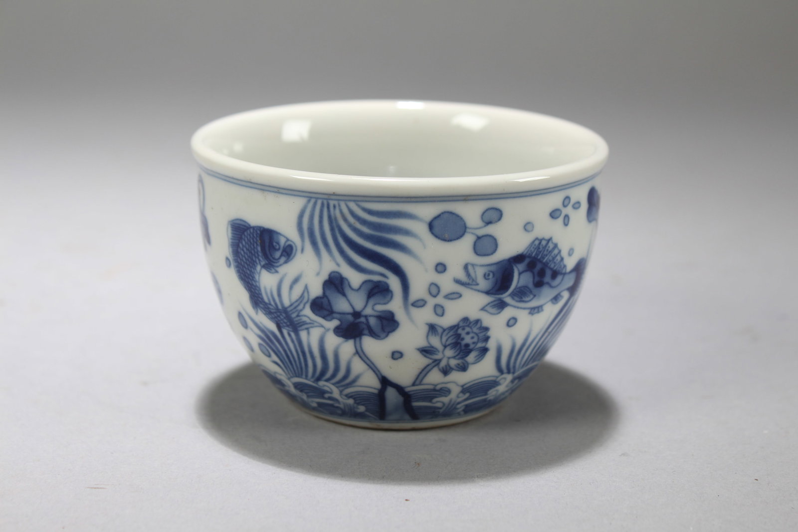 A Chinese Blue-and-white Porcelain Aqua-fortune Cup: A Chinese Blue-and-white Porcelain Aqua-fortune Cup. Height: 2 (inch). Opening Diameter: 3.25 (inch)