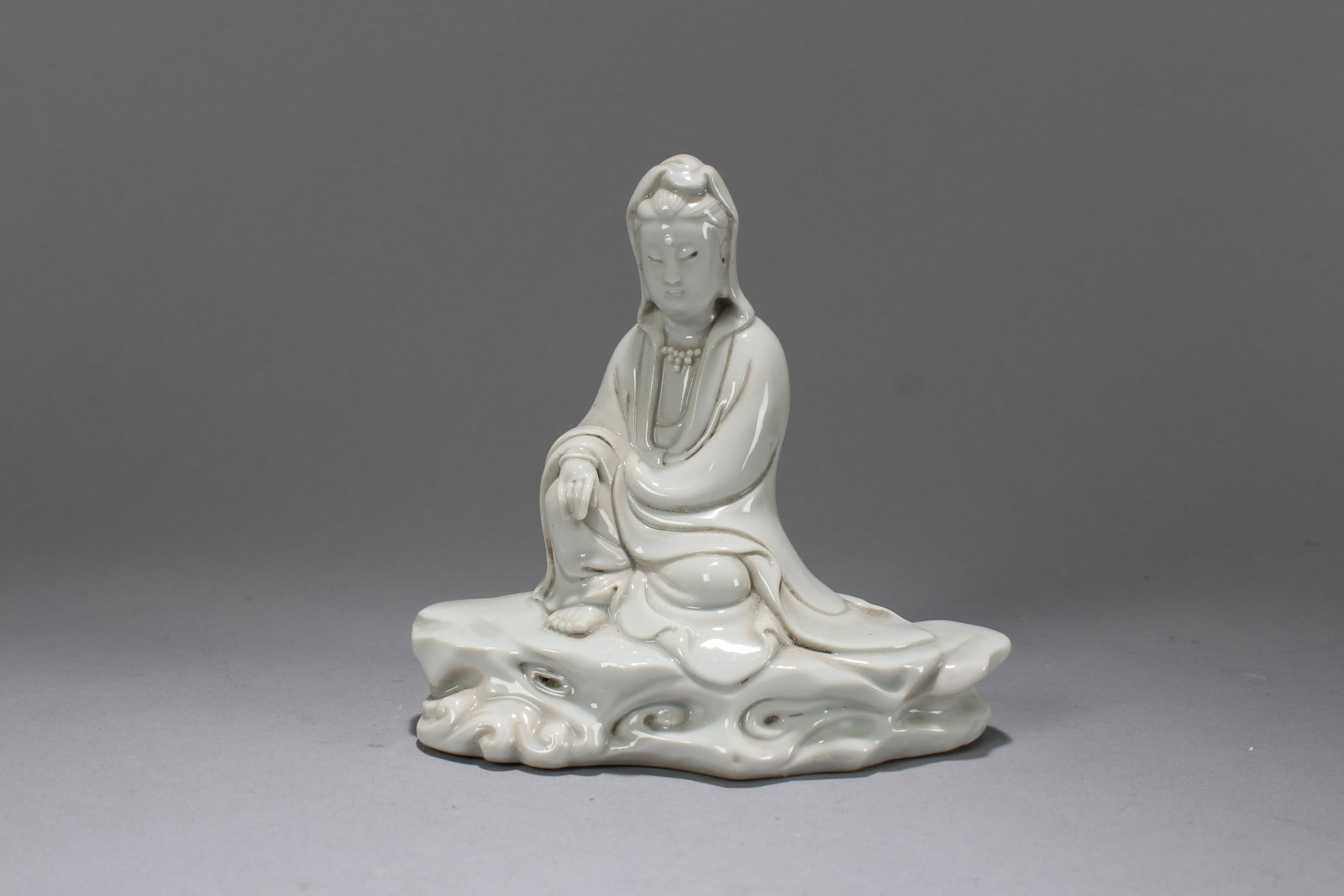 A Chinese De Blac Porcelain Fortune Guanyin Fortune Statue: A Chinese De Blac Porcelain Fortune Guanyin Fortune Statue. Height: 5 (inch). Width: 5 (inch). Length: 3 (inch)