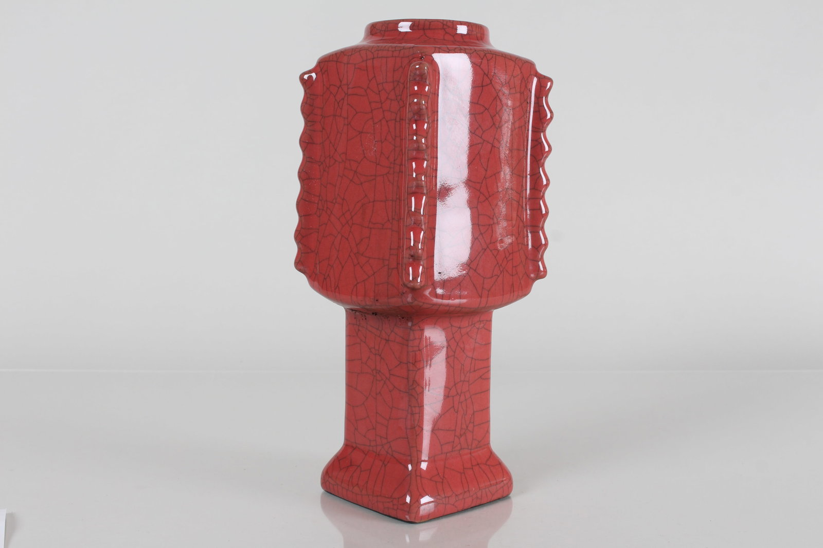 A Chinese Square-based Crackglaze Red Porcelain Vase: A Chinese Square-based Crackglaze Red Porcelain Vase . Height: 8.75 (inch).