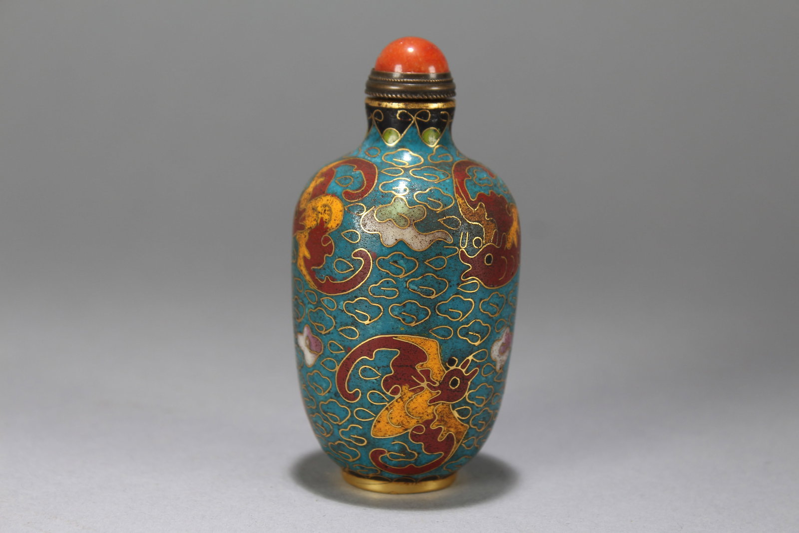 A Chinese Vividly-detailed Bat-framing Fortune Cloisonne Snuff Bottle: A Chinese Vividly-detailed Bat-framing Fortune Cloisonne Snuff Bottle. Height : 3.25 (inch). Opening Diameter : 1.75 (inch).
