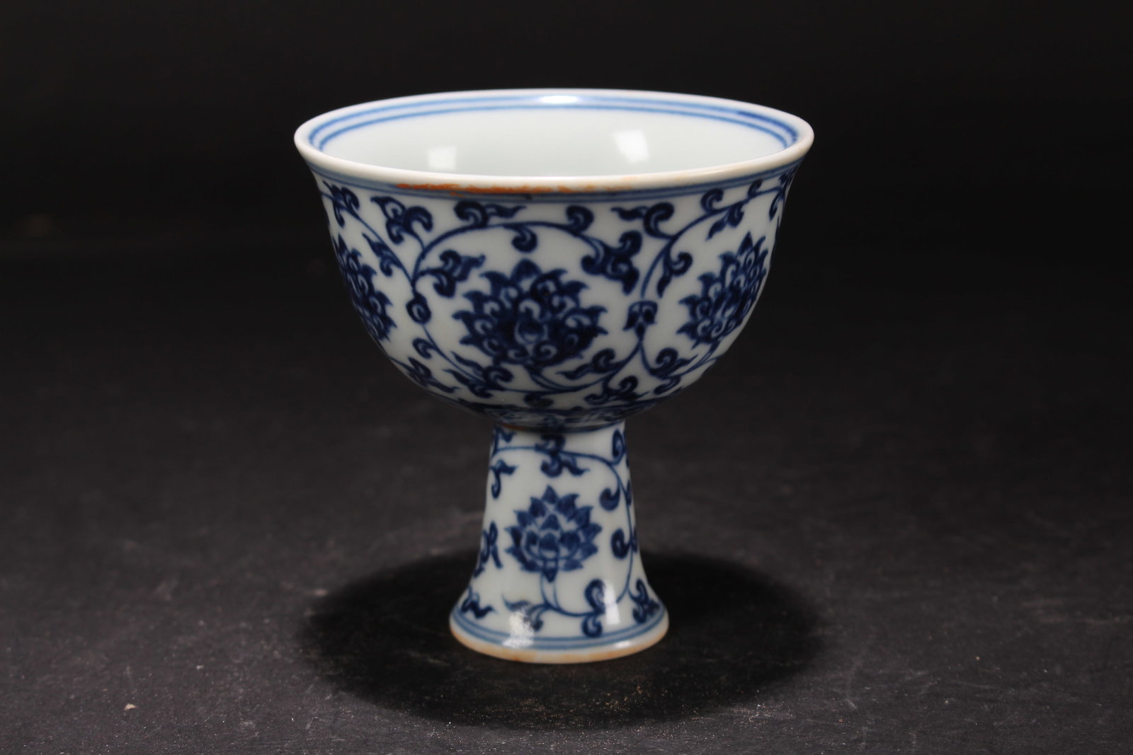 A Chinese Flower-blossom Blue and White Porcelain Fortune Cup: A Chinese Flower-blossom Blue and White Porcelain Fortune Cup. Height: 3.5 (inch). Opening Diameter: 3.5 (inch).
