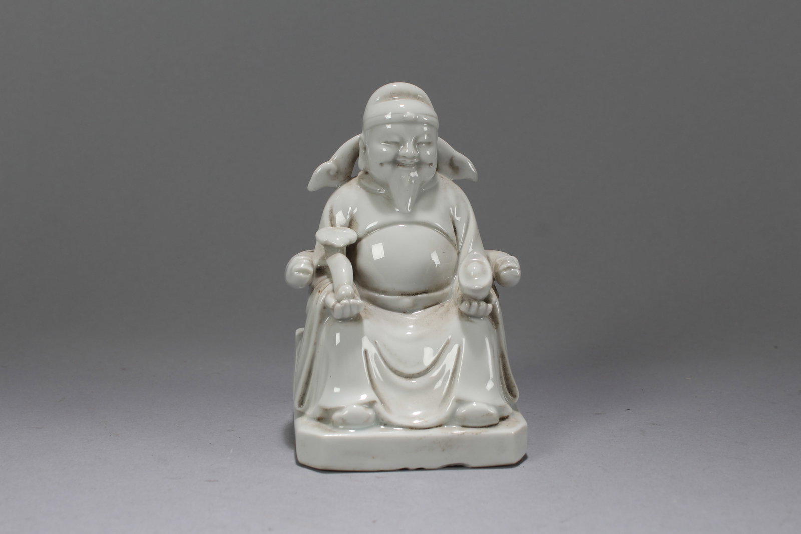 A Chinese De Blac Business-fortune Porcelain Statue: A Chinese De Blac Business-fortune Porcelain Statue. Height: 4.75 (inch). Width: 2.75 (inch). Length: 3 (inch)