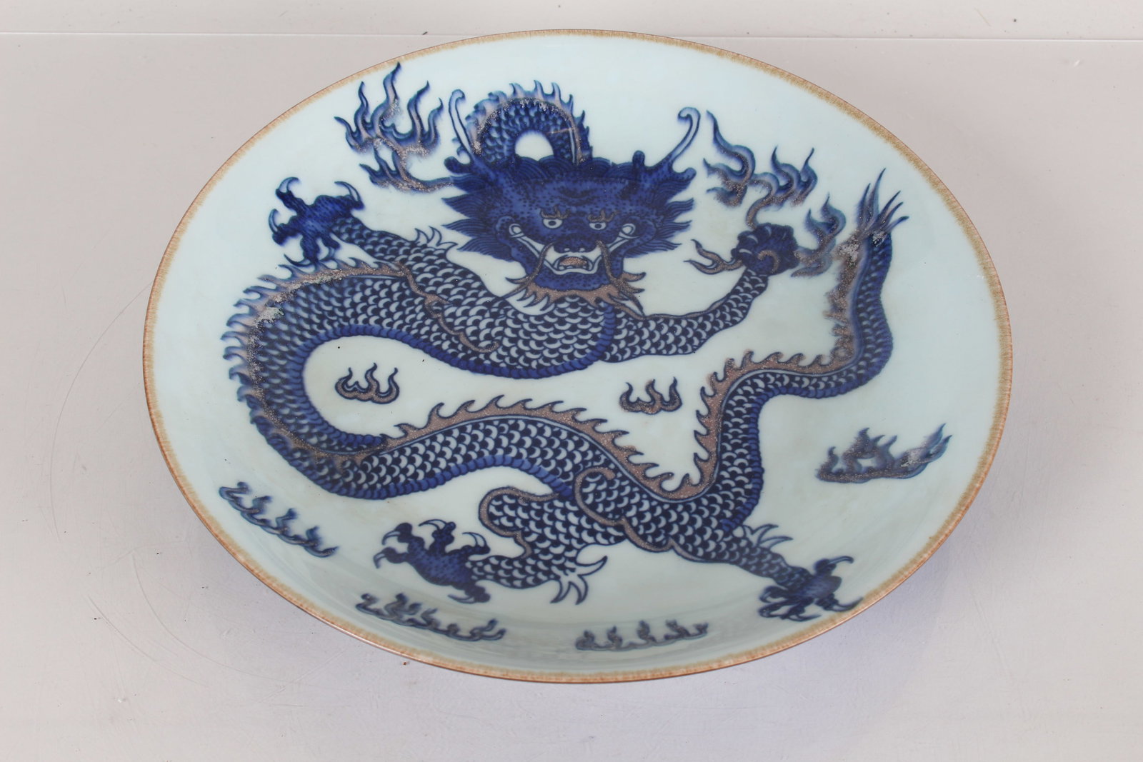 A Chinese Dragon-decorating Blue and White Porcelain Fortune Plate: A Chinese Dragon-decorating Blue and White Porcelain Fortune Plate. Height: 2 (inch). Opening Diameter: 11.5 (inch).
