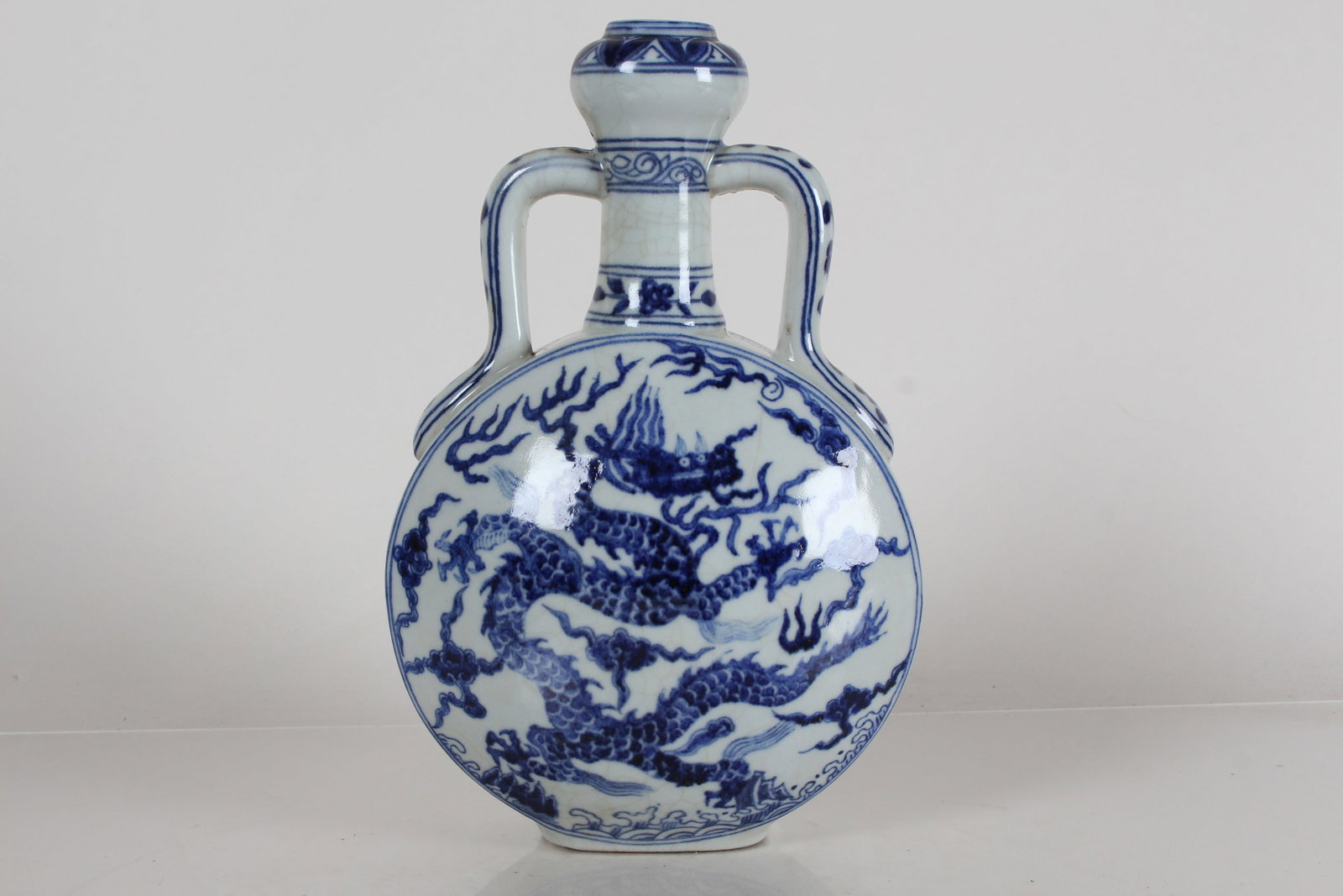A Chinese Duo-handled Dragon-decorating Blue and White Porcelain Fortune Vase: A Chinese Duo-handled Dragon-decorating Blue and White Porcelain Fortune Vase .Height: 10(inch).