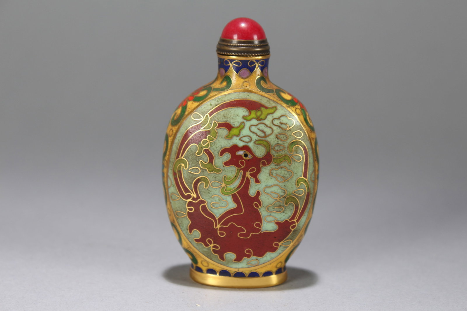 A Chinese Vividly-detailed Bat-framing Cloisonne Fortune Snuff Bottle: A Chinese Vividly-detailed Bat-framing Cloisonne Fortune Snuff Bottle. Height : 3.25 (inch). Width : 2 (inch). Length : 1 (inch).
