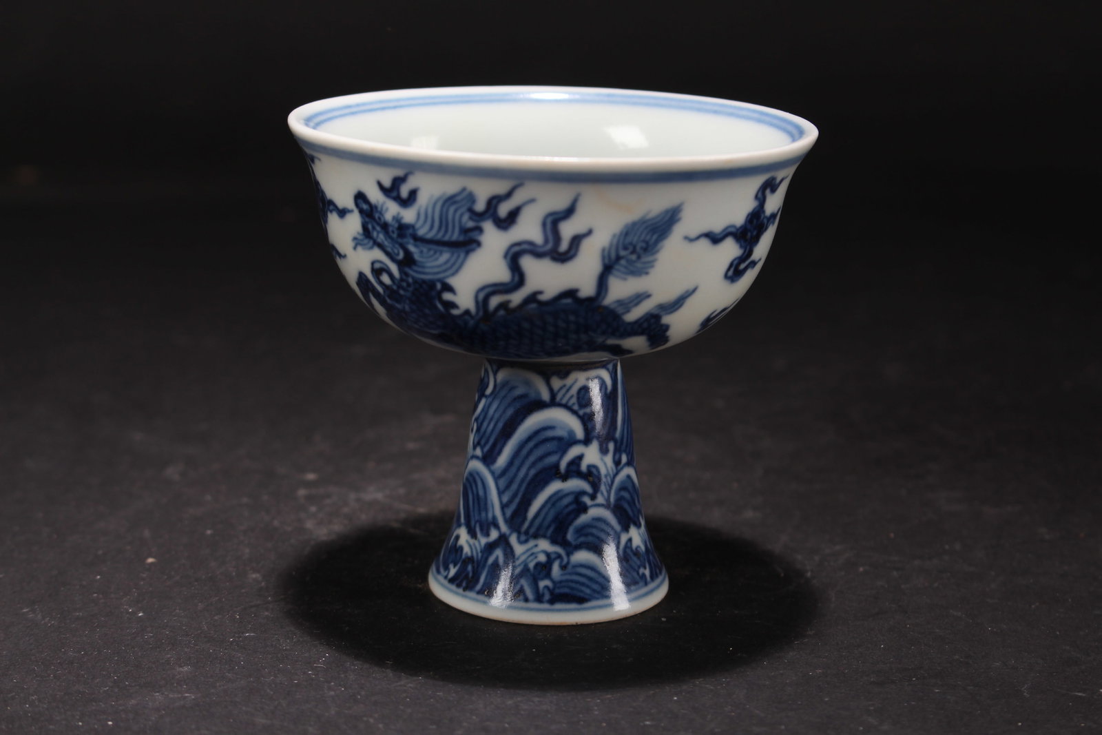 A Chinese Dragon-decorating Porcelain Fortune Cup: A Chinese Dragon-decorating Porcelain Fortune Cup. Height: 3.5 (inch). Opening Diameter: 3.5 (inch).
