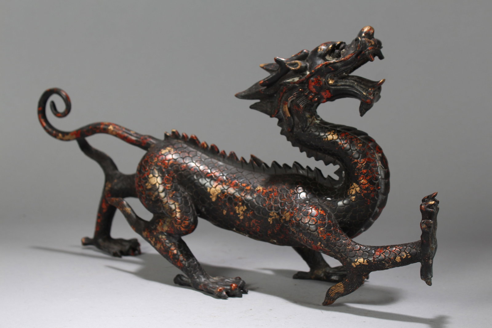 A Chinese Massive Dragon-decorating Religious Fortune Statue: A Chinese Massive Dragon-decorating Religious Fortune Statue. Height: 8 (inch). Length: 14 (inch). Width: 3.5 (inch).