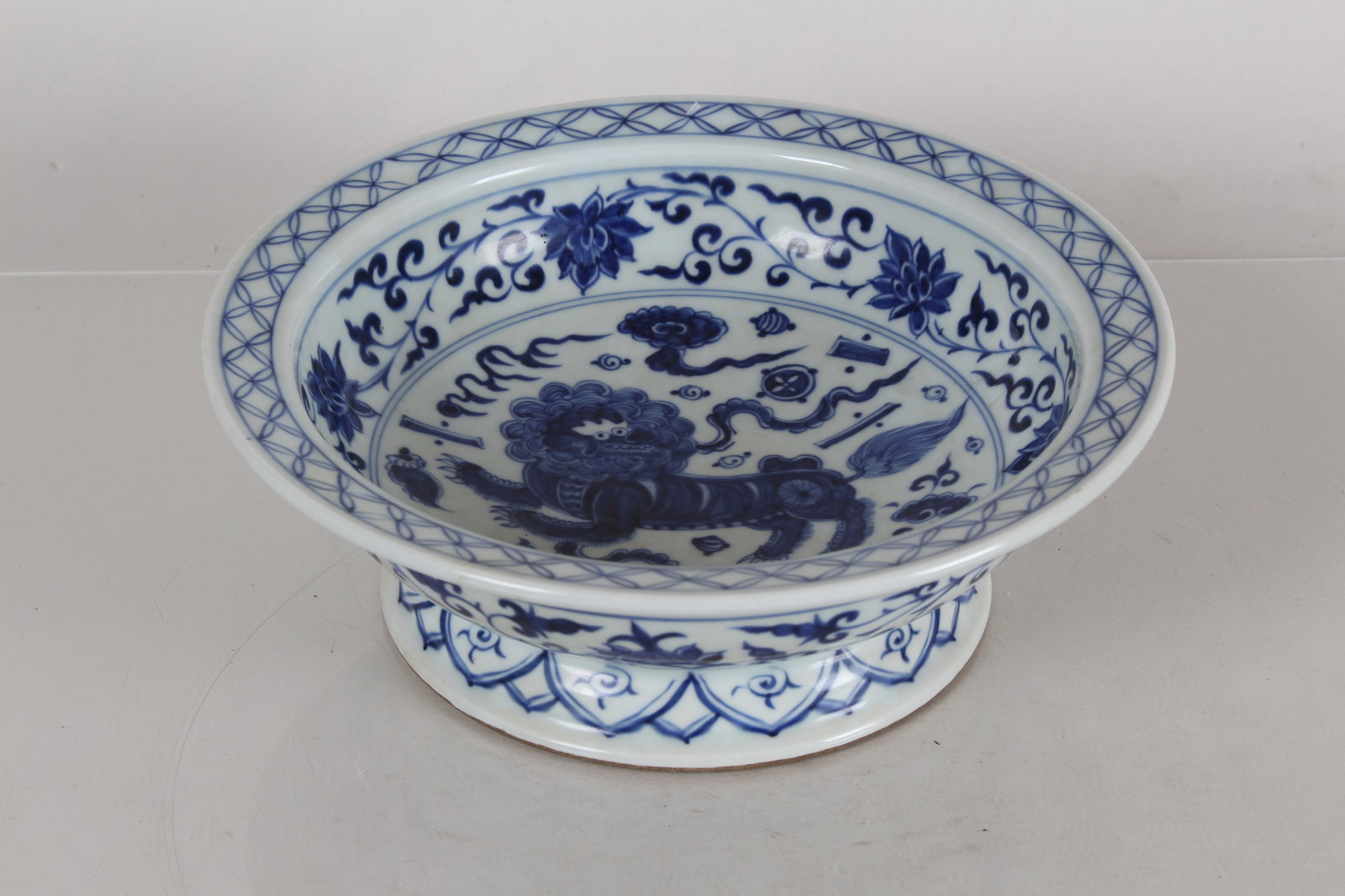 A Chinese Blue and White Myth-beast Porcelain Fortune Tall-end Bowl: A Chinese Blue and White Myth-beast Porcelain Fortune Tall-end Bowl. Height: 3 (inch). Opening Diameter: 6.75 (inch).