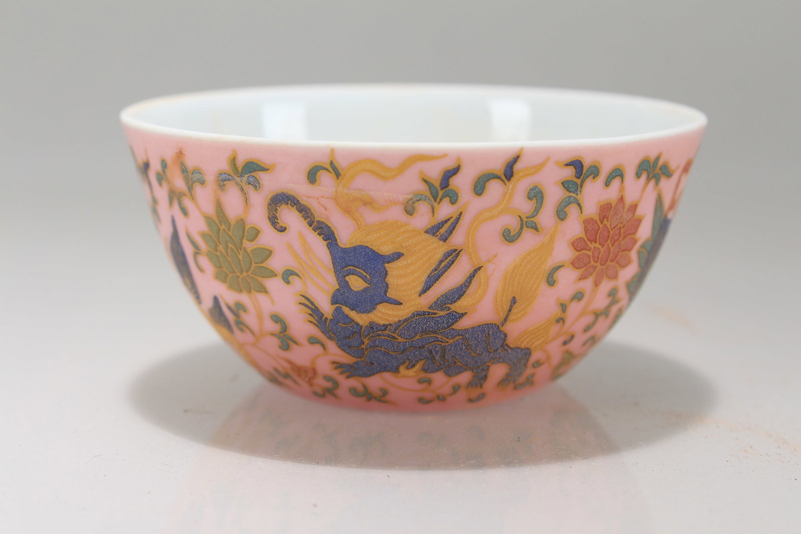 A Chinese Ancient-framing Pink-coding Porcelain Fortune Cup: A Chinese Ancient-framing Pink-coding Porcelain Fortune Cup. Height: 1.75 (inch). Opening Diameter: 3.5 (inch).