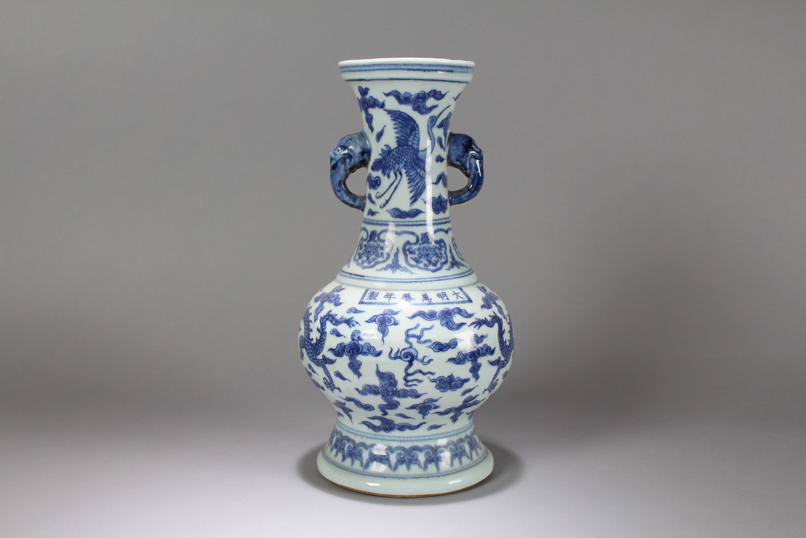 A Chinese Fortune Porcelain Vase: A Chinese Blue-and-white Dragon-decorating Porcelain Fortune Vase. Height: 13 (inch). Opening Diameter: 6.5 (inch)