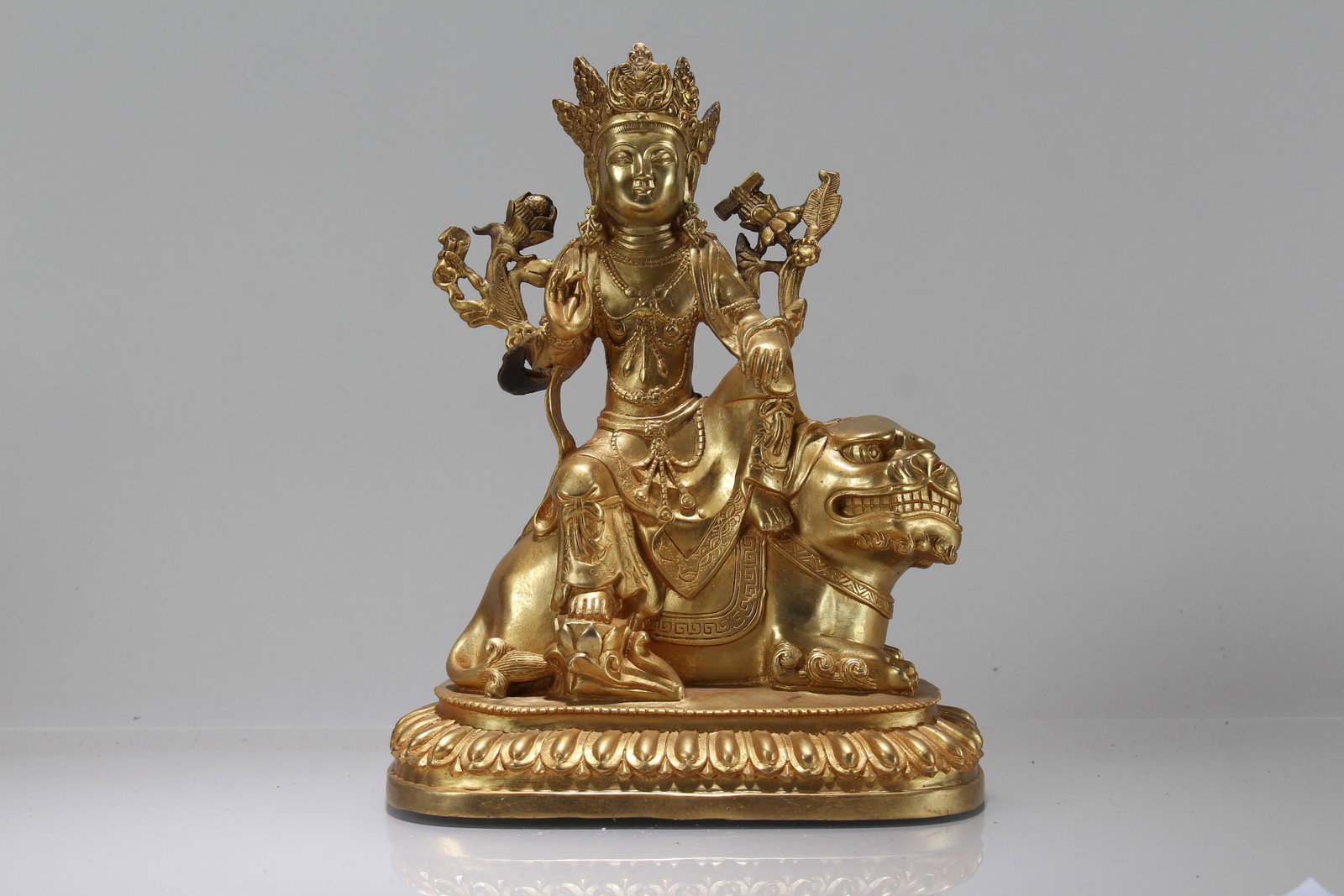 A Chinese Gilt Religious Fortune Buddha Statue: A Chinese Gilt Religious Fortune Buddha Statue. Height: 9.5 (inch). Length: 7 (inch). Width: 4.75 (inch).