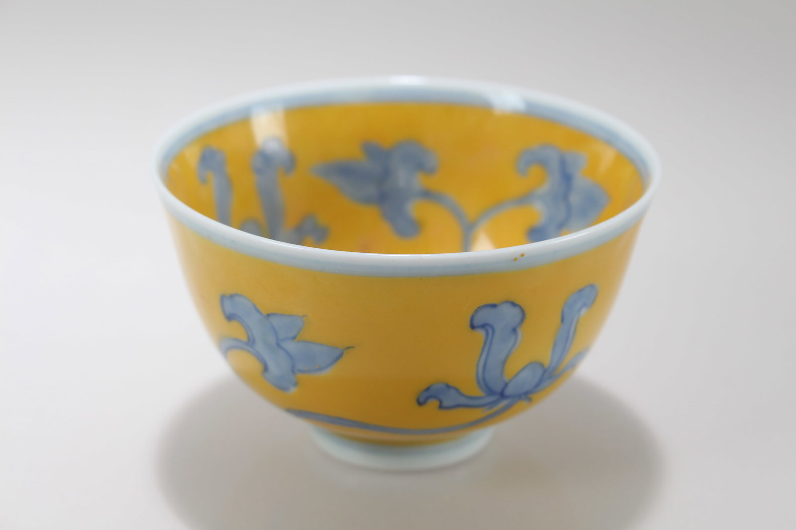 A Chinese Yellow-coding Blue and White Porcelain Cup: A Chinese Yellow-coding Blue and White Porcelain Cup. Height: 1.75 (inch). Opening Diameter: 3 (inch)