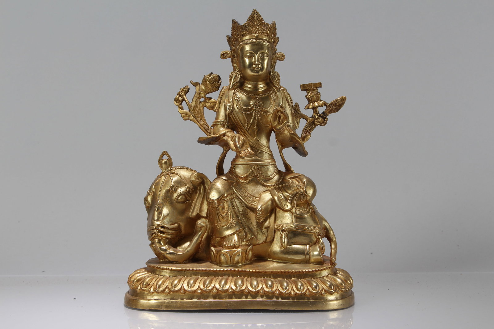 A Chinese Gilt Religious Fortune Buddha Statue: A Chinese Gilt Religious Fortune Buddha Statue. Height: 9.5 (inch). Length: 7 (inch). Width: 4.75 (inch).