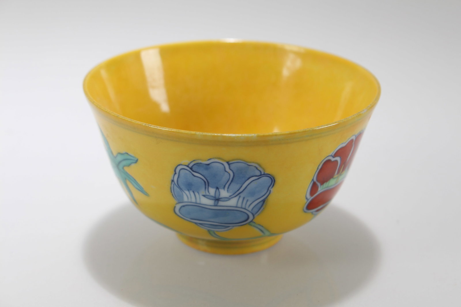 A Chinese Yellow-coding Blue and White Porcelain Cup: A Chinese Yellow-coding Blue and White Porcelain Cup. Height: 1.75 (inch). Opening Diameter: 3 (inch)