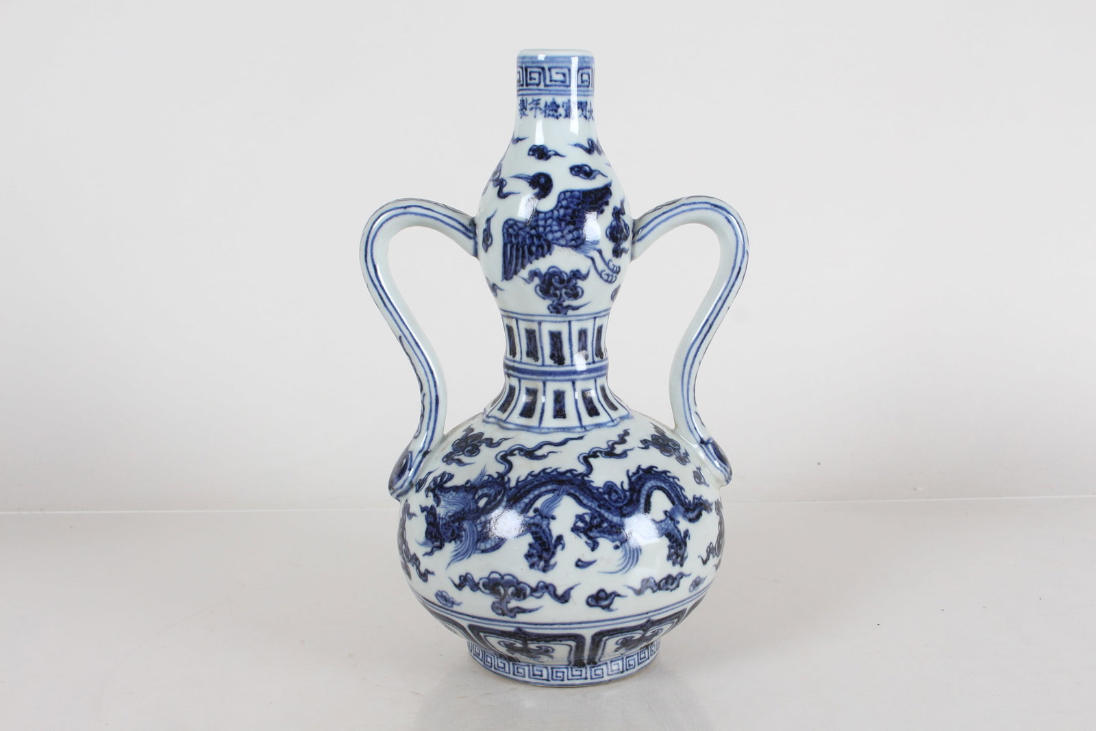 A Chinese Dragon-decorating Duo-handled Blue and White Porcelain Fortune Vase: A Chinese Dragon-decorating Duo-handled Blue and White Porcelain Fortune Vase . Height: 10(inch).