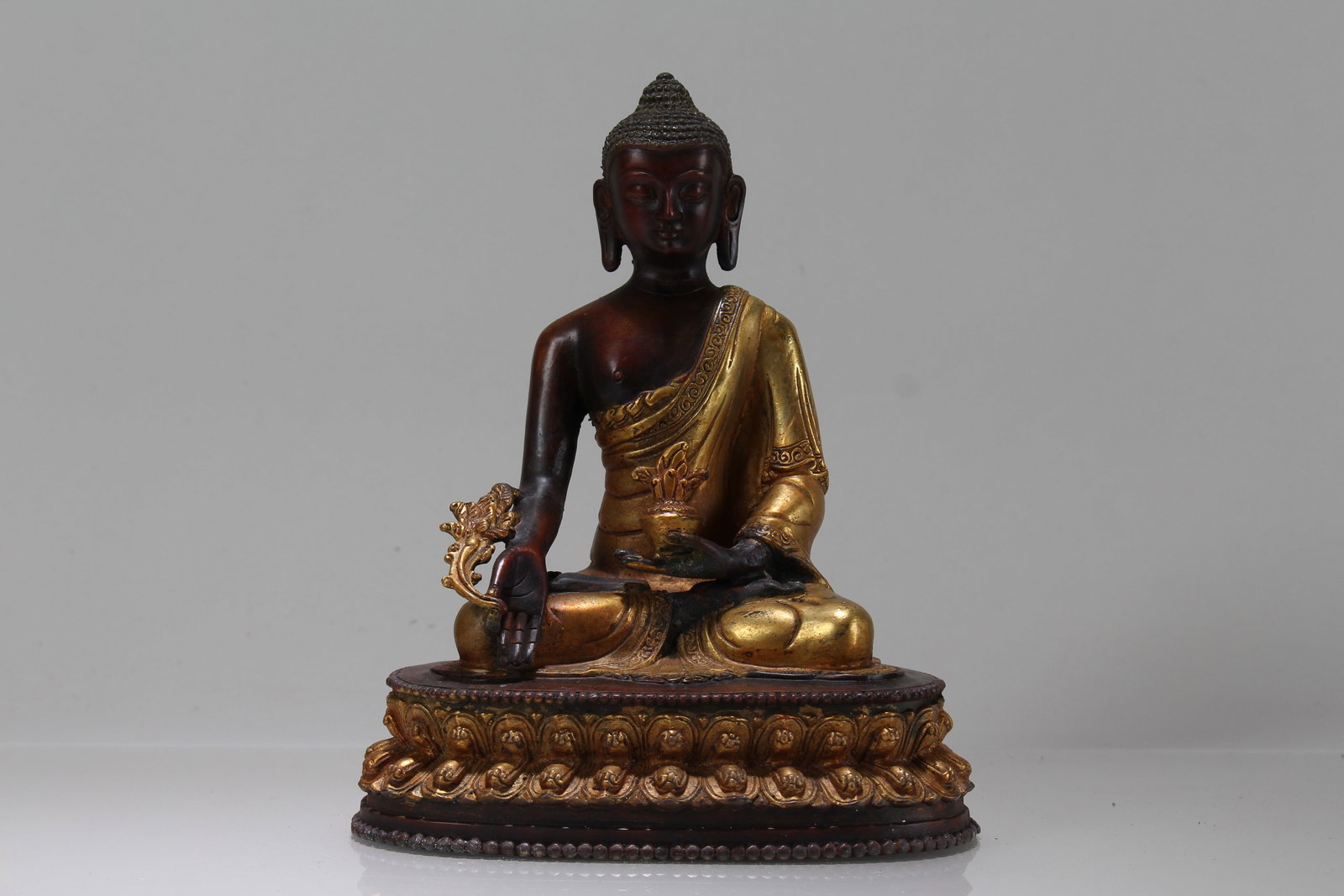 A Chinese Lotus-seated Fortune Buddha Statue: A Chinese Lotus-seated Fortune Buddha Statue. Height: 8 (inch). Length: 6 (inch). Width: 4 (inch).