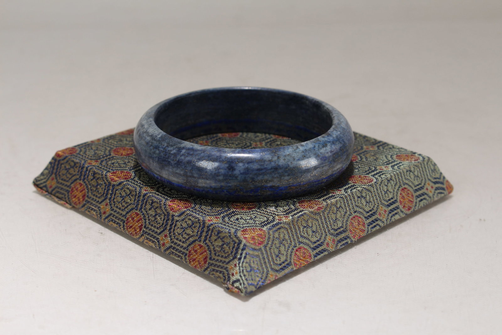 A Chinese Circular Fortune Bracelet: A Chinese Circular Fortune Bracelet. Opening Diameter: 2.75 (inch).