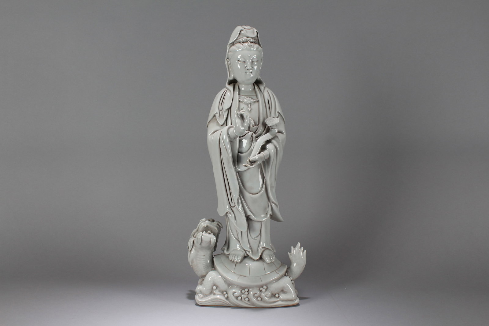 A Chinese Massive Vividly-detailed De Blac Porcelain Fortune Buddha Statue: A Chinese Massive Vividly-detailed De Blac Porcelain Fortune Buddha Statue. Height: 18.25 (inch). Width: 8 (inch). Length: 4.25 (inch).