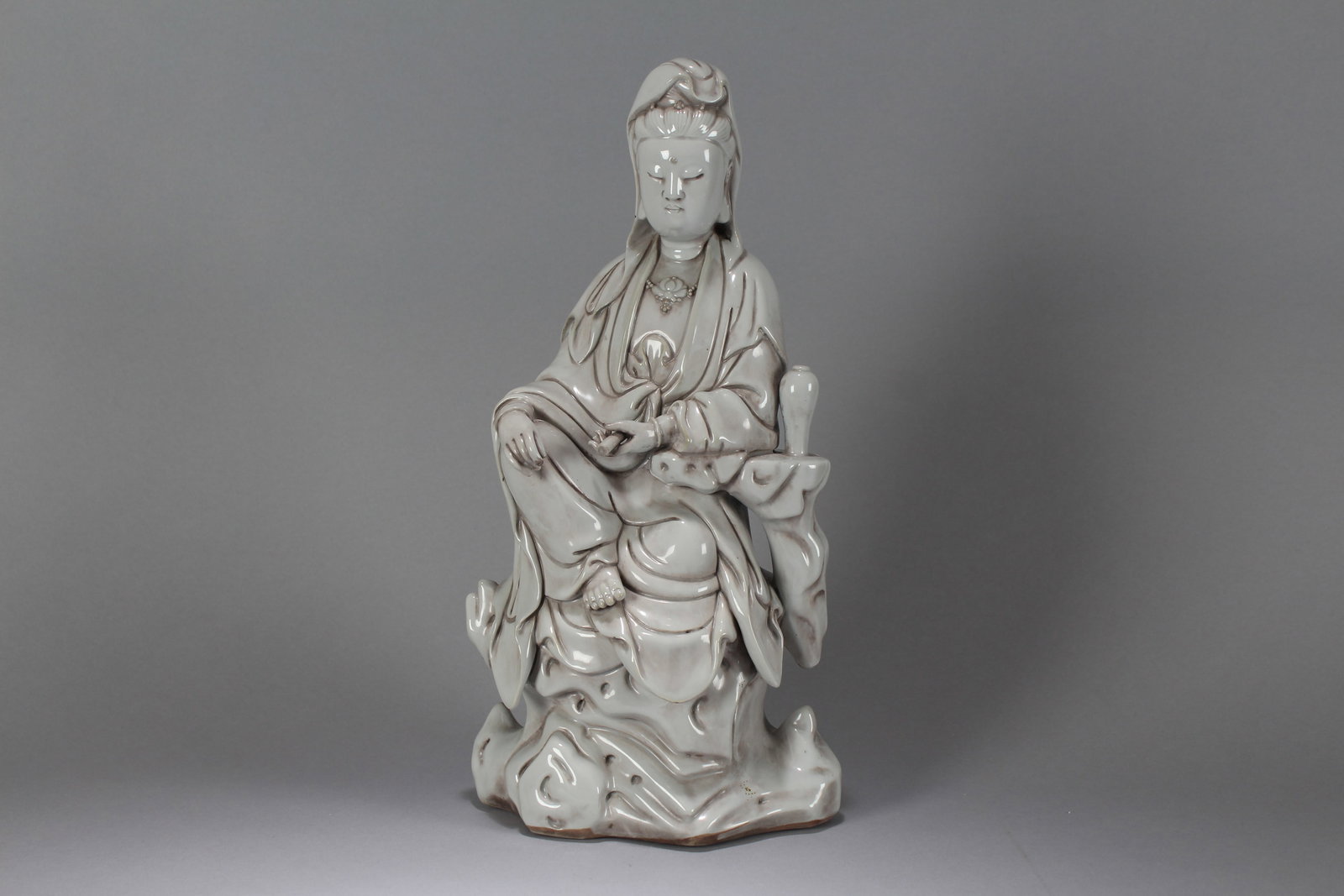 A Chinese Massive Vividly-detailed De Blac Porcelain Fortune Buddha Statue: A Chinese Massive Vividly-detailed De Blac Porcelain Fortune Buddha Statue. Height: 14.5 (inch). Width: 6.5 (inch). Length: 4 (inch).