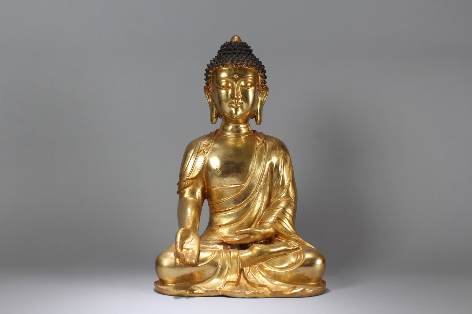 A Chinese Pondering-pose Gilt Fortune Buddha Statue: A Chinese Lotus-seated Gilt Fortune Buddha Statue. Height: 17.5 (inch). Width: 11 (inch). Length: 8 (inch)