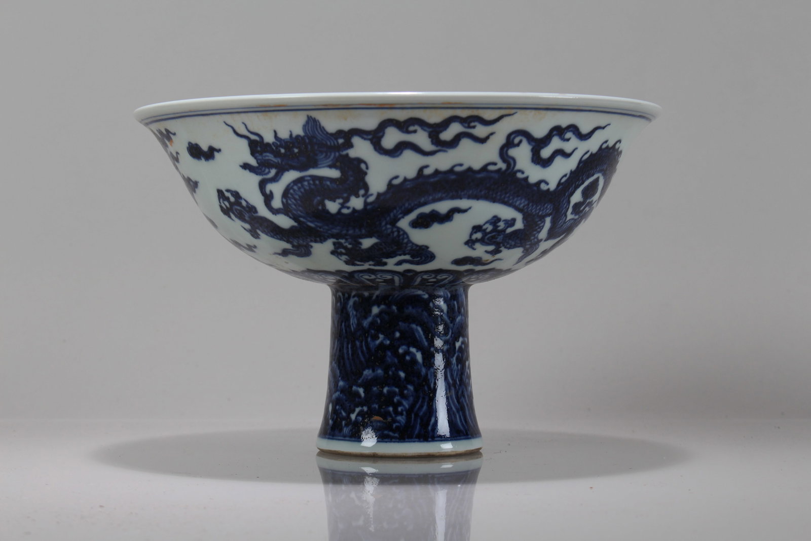 A Chinese Dragon-decorating Blue and White Porcelain Cup: A Chinese Dragon-decorating Blue and White Porcelain Cup. Height: 6.25 (inch). Opening Diameter: 9.5 (inch).