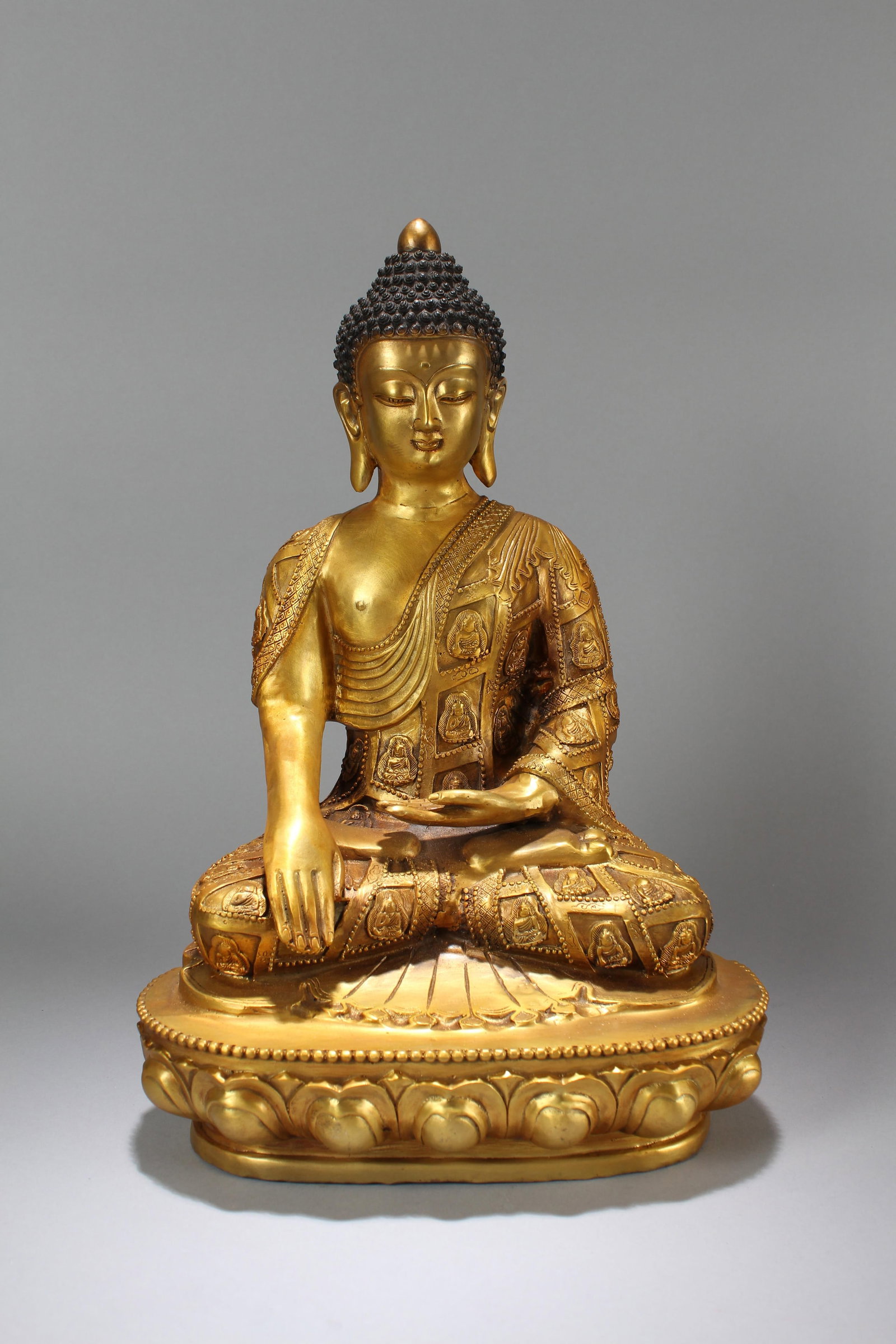A Chinese Lotus-seated Gilt Fortune Buddha Statue: A Chinese Pondering-pose Gilt Fortune Buddha Statue. Height: 17.5 (inch). Width: 12 (inch). Length: 8 (inch)