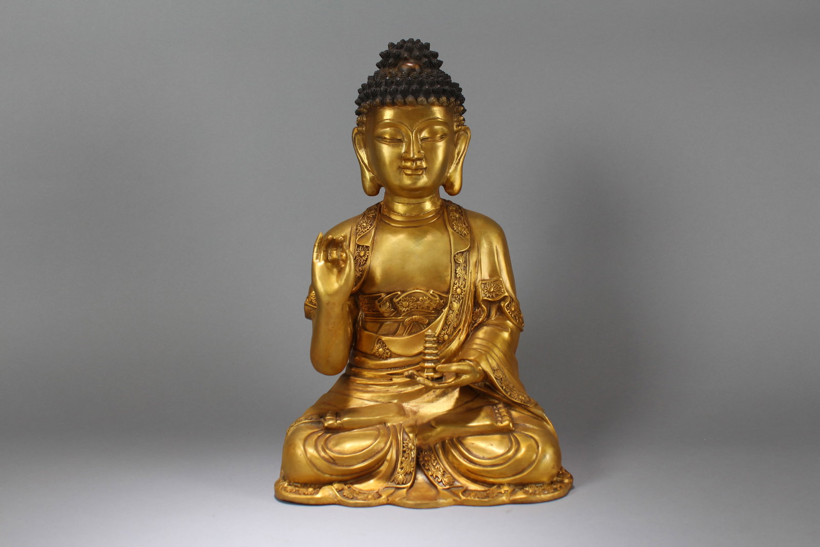A Chinese Pondering-pose Gilt Fortune Buddha Statue: A Chinese Lotus-seated Gilt Fortune Buddha Statue. Height: 16.5 (inch). Width: 10.5 (inch). Length: 7 (inch)