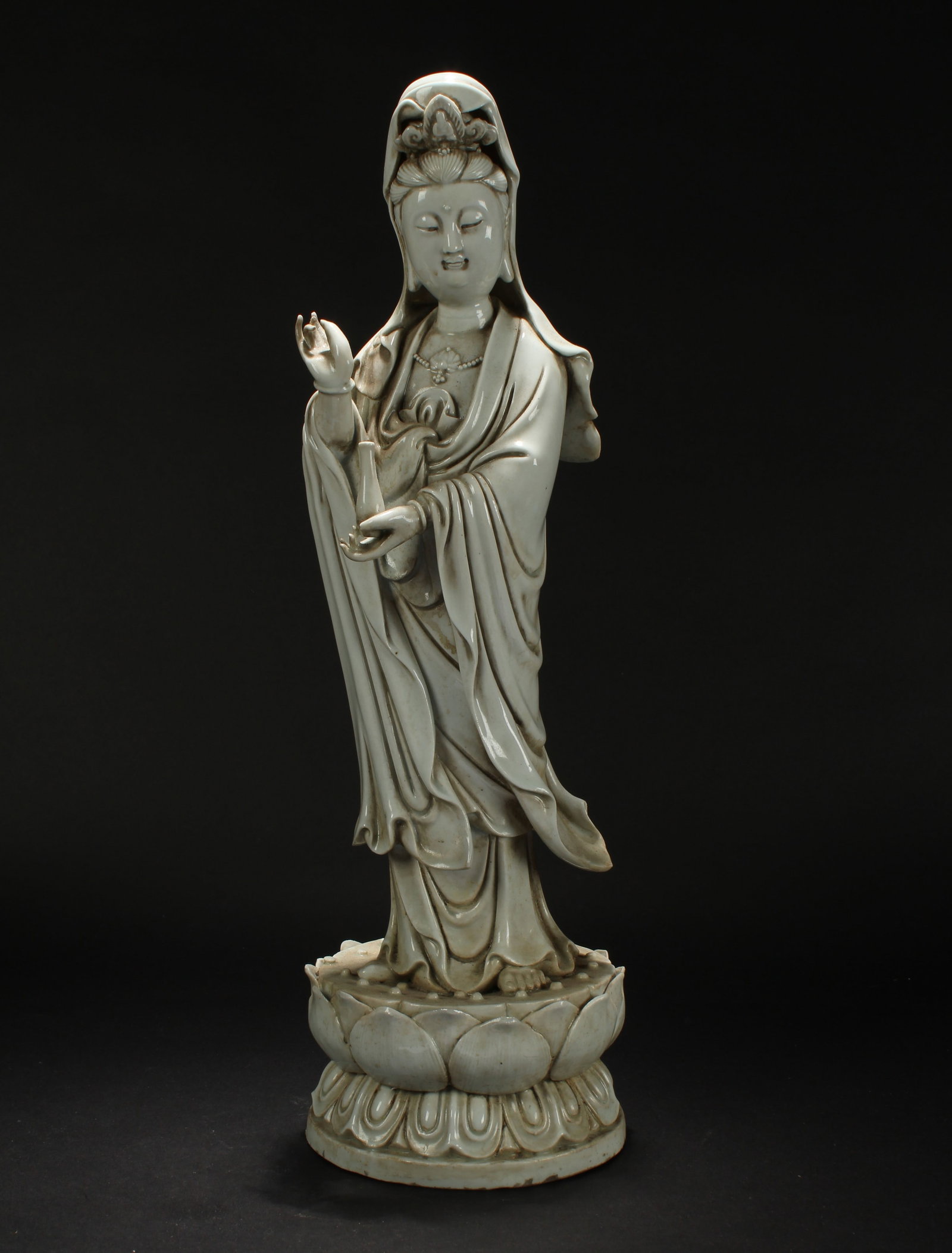A Chinese Religious Lotus-seated De Blanc Porcelain Statue: A Chinese Religious Lotus-seated De Blanc Porcelain Statue . Height: 17.25 (inch).