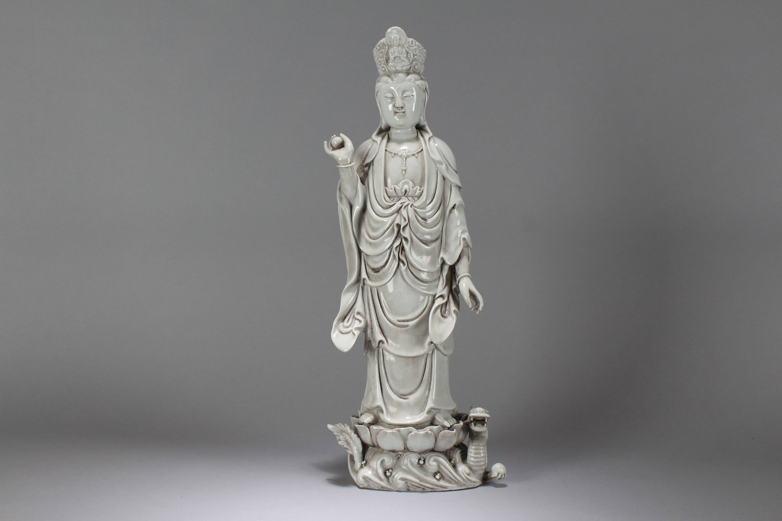 A Chinese Massive Vividly-detailed De Blac Porcelain Religious Buddha Statue: A Chinese Massive Vividly-detailed De Blac Porcelain Religious Buddha Statue. Height: 18 (inch). Width: 7 (inch). Length: 4.25 (inch).