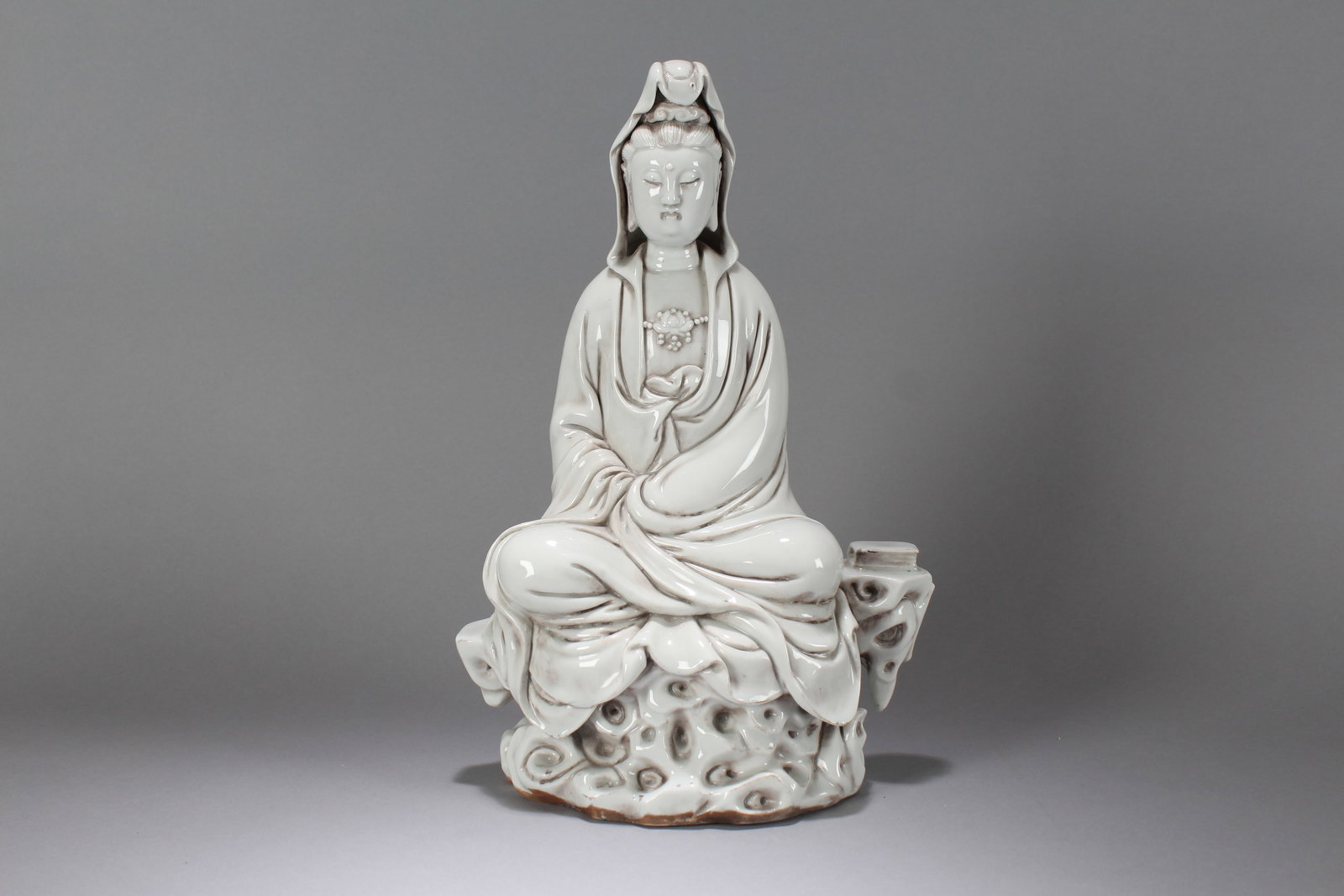 A Chinese Massive Vividly-detailed De Blac Porcelain Religious Buddha Statue: A Chinese Massive Vividly-detailed De Blac Porcelain Religious Buddha Statue. Height: 13.25 (inch). Width: 9.5 (inch). Length: 5.75 (inch).