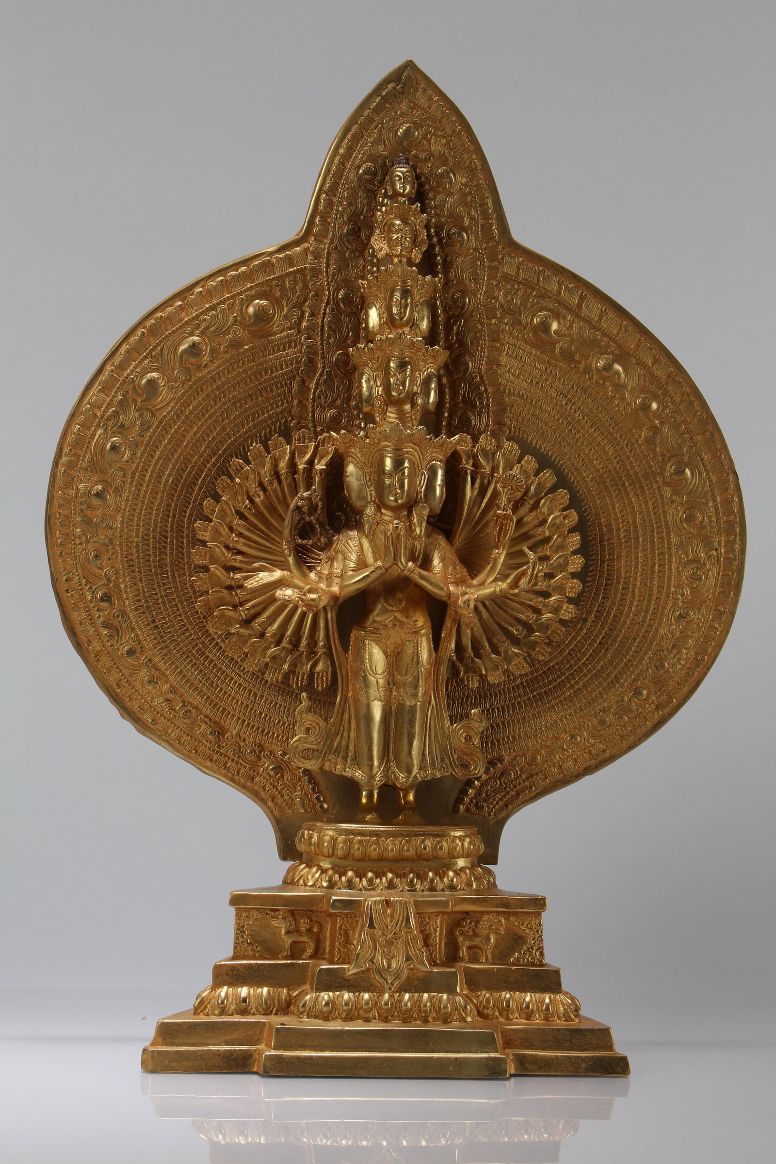 A Chinese Gilt Thousand-hand Religious Buddha Statue: A Chinese Gilt Thousand-hand Religious Buddha Statue. Height: 17.25 (inch).