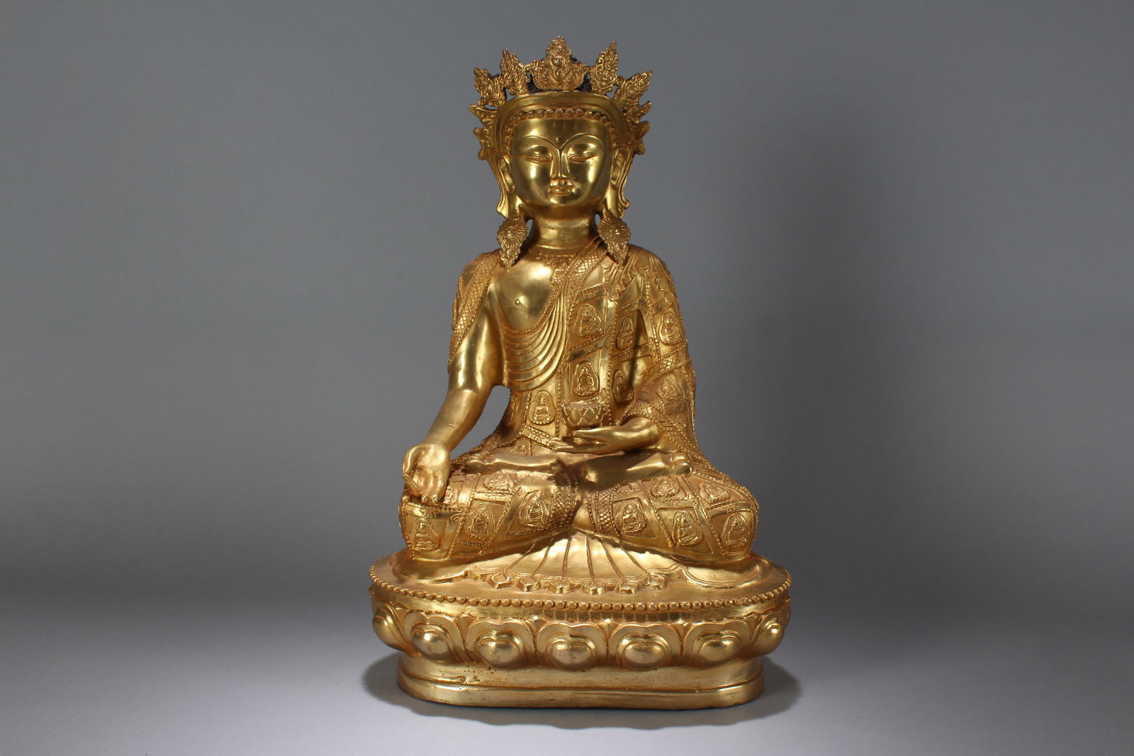 A Chinese Religious Lotus-seated Gilt Fortune Massive Buddha Statue: A Chinese Religious Lotus-seated Gilt Fortune Massive Buddha Statue. Height: 18 (inch). Width: 11.5 (inch). Length: 7 (inch).