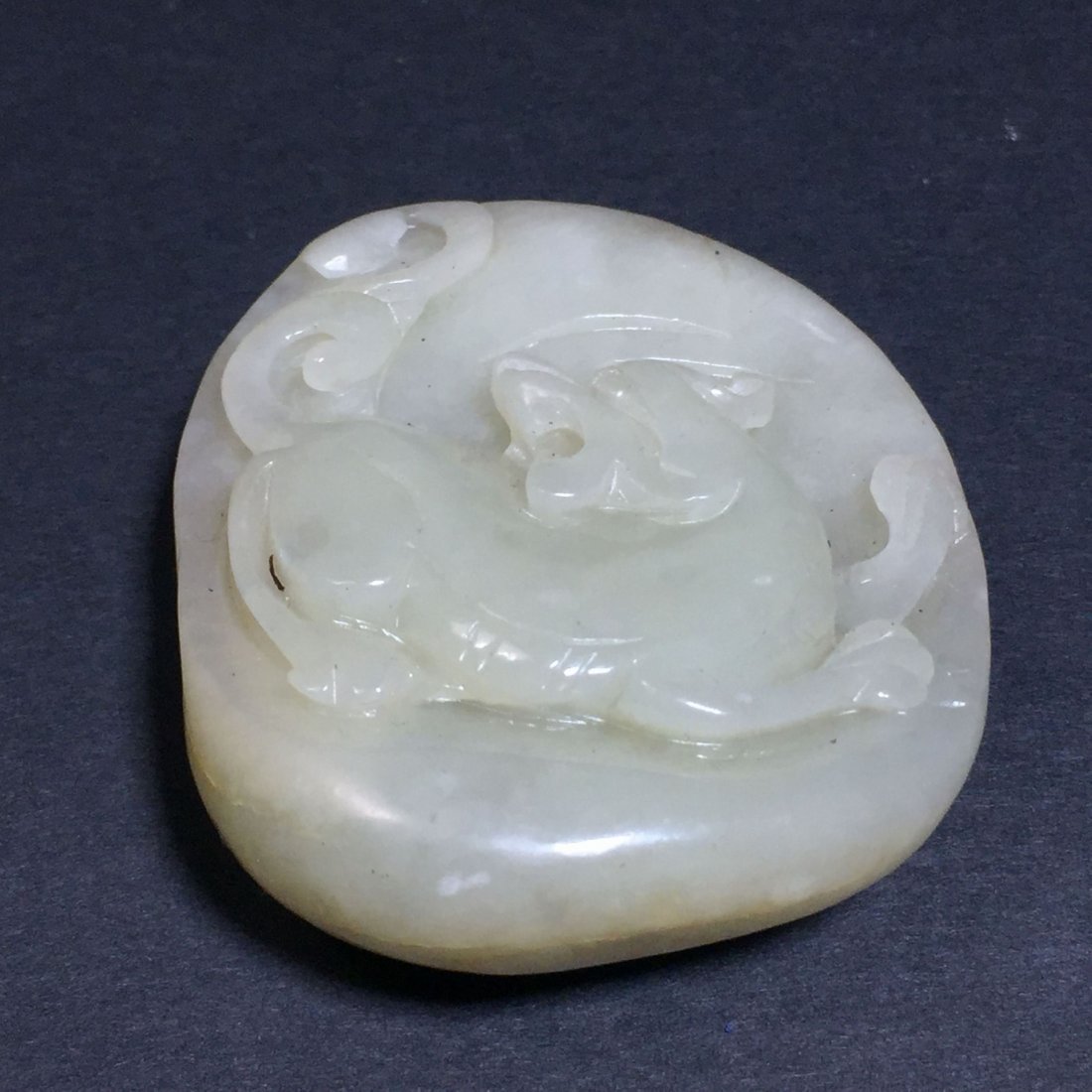 A Hotan River Jade Curving Lion Figure (1 of 5)