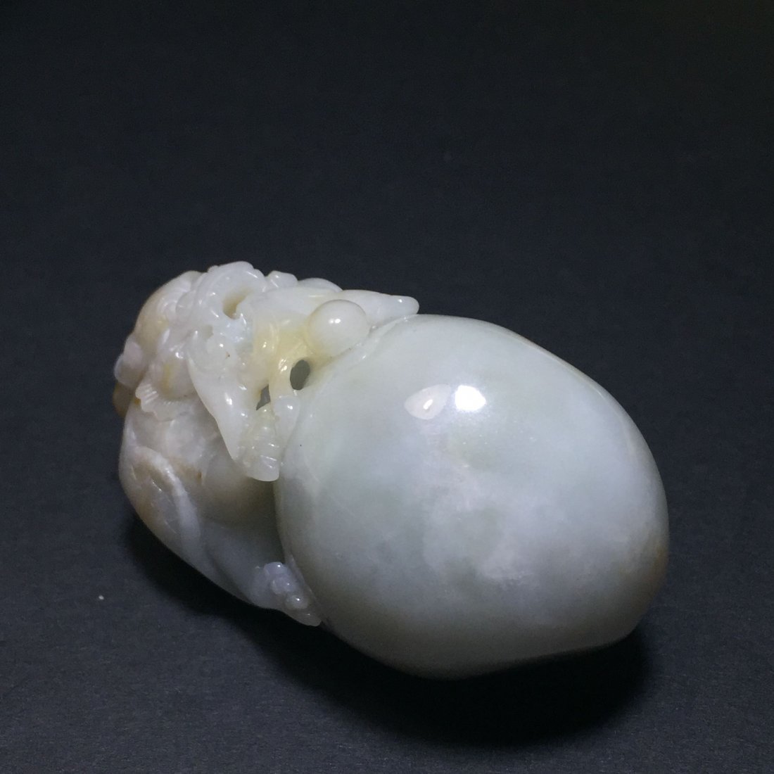 A Round Jade Dragon-breathing Figure (1 of 8)