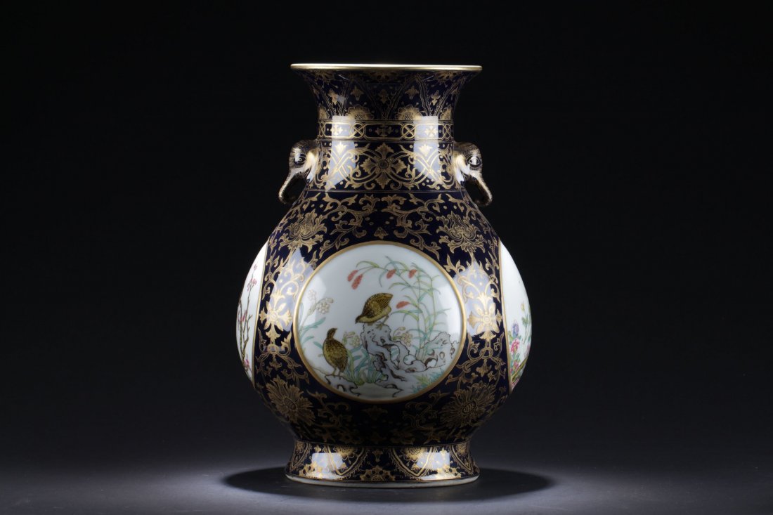 A Chinese Detailed Elephant-handled Windowed Birds: Of baluster form, raised from a spreading pedestal foot to a flared neck and flanked by two elephant-shaped handles, the body is decorated with blossoms foliate scrolls. The four circular round panels