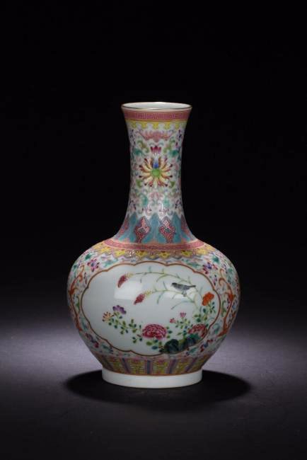 A Chinese Famille Rose Windowed Vase: A Chinese Famille Rose Windowed Vase. Height: 9 (inch). Opening Diameter: 2.5 (inch).