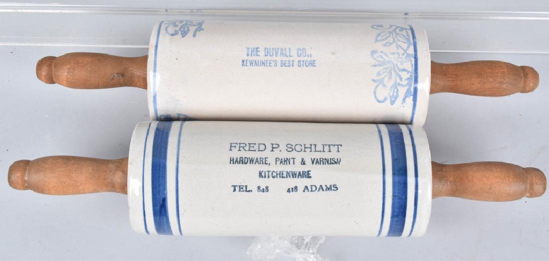 2-ADVERTISING STONEWARE ROLLING PINS: Both about 14", one is Fred P. Schlitt Hardware, and the other is The Duvall Co Both have light wear. Nice banded colors and advertising. Very Good-Excellent