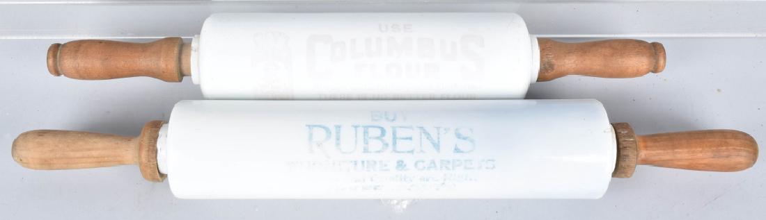 2-ADVERTISING ROLLING PINS: Largest is 21" and is marked Buy Ruben's Furniture and Carpets, the smaller one is marked Columbus Flour. Both have fading to lettering, but display well. Very Good