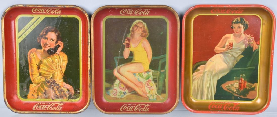 3-COCA COLA SERVING TRAYS, 1930, 1932, and 1936: All measure about 13'" by 10", great graphics and colors. The 1930 has some rust and wear on the obverse. The other two have minor wear. Condition varies. Good-Very Good