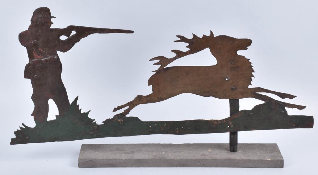 EARLY FOLK ART HUNTER & STAG WEATHER VANE: Excellent early Folk Art Weather Vane. Great looking hand cut and hammered Hunter with Gun shooting a Stag Deer. Looks to be original paint that has been shellacked. Metal shows some age and wear. 32"