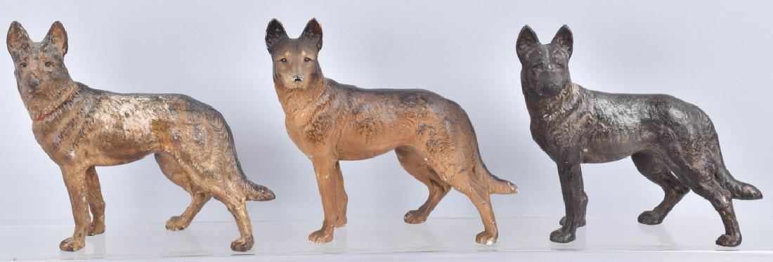 3-GERMAN SHEPHARD CAST IRON DOORSTOPS: Measure about 9" by 9", two have nice original paint , and one is over painted with a chip of the back. General wear and loss. Condition varies. Good-Very Good